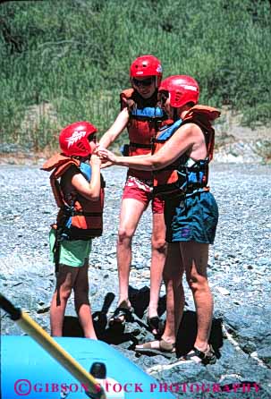 Stock Photo #5664: keywords -  adventure boat boater boating check child children daughter daughters equipment expedition family float flotation gear girl girls group helmet inflatable inflate jacket life material mother outdoor outdoors outside paddle paddler paddlers paddling parent parents plastic raft rafting recreation red released rubber safety single sister sisters sport sports stream summer synthetic team thrill travel trip vacation vert vest water