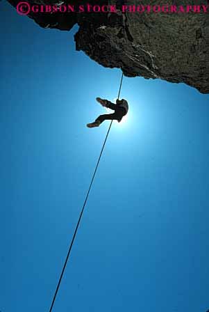 Stock Photo #5673: keywords - achieve achievement achiever achieving agile agility along ascend ascending belay brave caution challenge cliff climb climber climbing commitment confidence danger ecosport edge elevate elevated endurance fall geology hang injury line outdoor outdoors outside over peaceful person potential private quiet recreation risk rock rockclimb rope scare scary silhouette solitary solitude solo sport sports steep strength strong summer support suspend suspended up upward vert