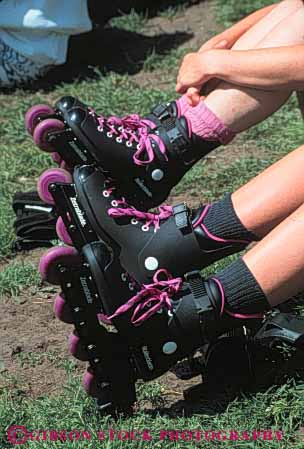 Stock Photo #5687: keywords - adolescence adolescent adolescents blade blades boot boots child children equipment fall feet foot fun gilder glide gliding gravity in leg legs line move movement outdoor outdoors outside pair play practice protect protection recreation roll roller rollerblade rollerblader rollerblading rollerskater rollerskating rolling safety shoe shoes skate skates skill sport sports summer vert wheel wheels youth youths