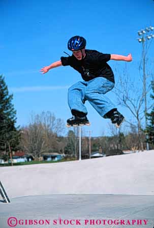 Stock Photo #5689: keywords - adolescence adolescent adolescents air blade boot boots boy catch caution child children danger equipment fall feet fly foot fun gilder glide gliding gravity helmet jump leg legs move movement outdoor outdoors outside play practice protect protection recreation risk roll roller rollerblade rollerblader rollerblading rollerskater rollerskating rolling safety shoe shoes skate skill sport sports summer vert wheel wheels youth youths