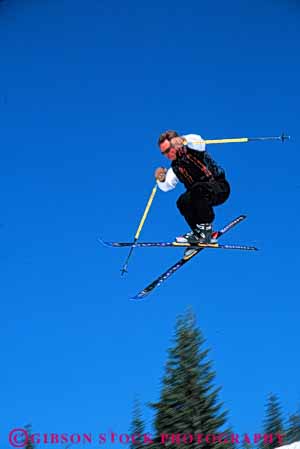 Stock Photo #5697: keywords -  action air born cold downhill gravity high jump leap man outdoor outdoors outside recreation resort season ski skier skiers skiing sky snow sport sports stop style vert winter