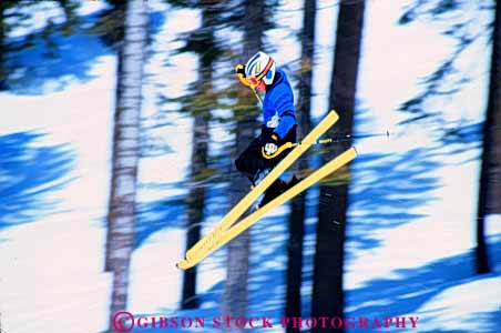 Stock Photo #5698: keywords -  action air born boy child children cold downhill gravity helmet high horz jump leap outdoor outdoors outside recreation resort season ski skier skiers skiing snow sport sports stop winter young