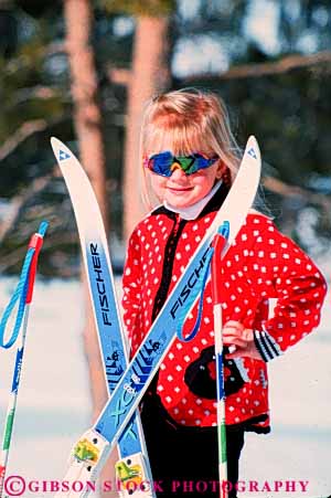 Stock Photo #5704: keywords -  blond child children cold color colorful cute daughter downhill equipment face girl outdoor outdoors outside pose pretty recreation released resort season ski skier skiers skiing smile snow sport sports sunglasses travel trip vacation vert winter