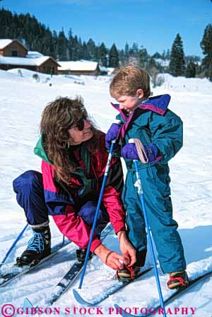 Stock Photo #5724: keywords -  adventure assist boy child children cold country cross crosscountry equipment exercise explore family help learn mother nordic outdoor outdoors outside parent practice recreation released resort season single ski skier skiers skiing snow son sport sports travel trip vacation vert winter woman