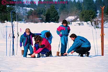 Stock Photo #5725: keywords - adventure assist assistance children cold country cross crosscountry equipment exercise explore family father help helper horz mother nordic outdoor outdoors outside preparation recreation released resort season share ski skier skiers skiing snow sport sports team together travel trip vacation winter