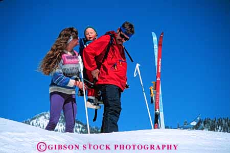 Stock Photo #5728: keywords -  adventure assist assistance backpack balance boy carry child children cold country couple cross crosscountry effort equipment exercise explore family father help horz load man mother nordic outdoor outdoors outside recreation released resort season share ski skier skiers skiing snow sport sports together travel trip vacation winter woman