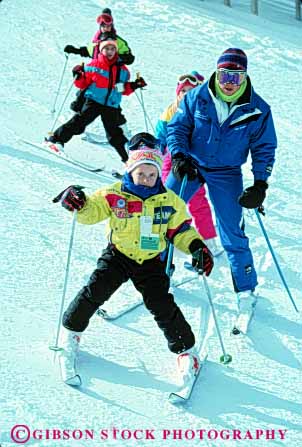 Stock Photo #5737: keywords -  boy boys career child childrens class cold equipment girl girls group instruct instructing instruction instructor job learn learning lesson outdoor outdoors outside practice recreation resort season ski skier skiers skiing snow sport sports teach teacher together travel trip vacation vert winter work youth