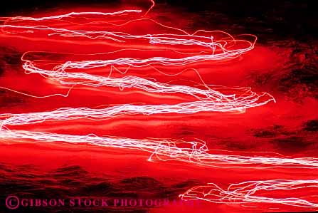 Stock Photo #5746: keywords -  abstract action blur bright display downhill evening flare horz light lighting lights motion move movement moving night parade pink red ski skier skiers skiing slope torch winter