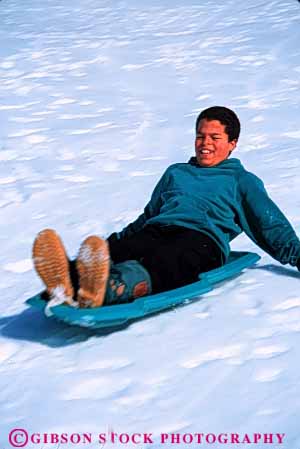 Stock Photo #5747: keywords - action african american black blur boy bright child children downhill ethnic fast fun gravity minority motion move movement plastic play recreation released sled sledders sledding slide slider sliders sliding slip slippery slipping snow speed sport thrill vert winter youth