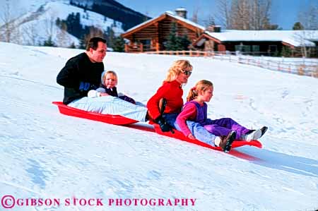 Stock Photo #5748: keywords -  action blur bright child children downhill family fast father fun gravity group horz husband mother motion move movement plastic play recreation released share sled sledders sledding slide slider sliders sliding slip slippery slipping snow speed sport thrill together wife winter