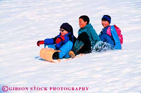 Stock Photo #5749: keywords -  action african american asian black blur boy bright child children downhill ethnic fast friend friends fun girl gravity horz laugh minority mix motion move movement plastic play recreation released sled sledders sledding slide slider sliders sliding slip slippery slipping smile snow social speed sport three thrill winter