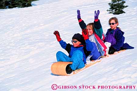 Stock Photo #5750: keywords -  action blur boy bright child children downhill fast friend friends fun girl girls gravity horz motion move movement plastic play recreation released sled sledders sledding slide slider sliders sliding slip slippery slipping snow social speed sport three thrill winter youth