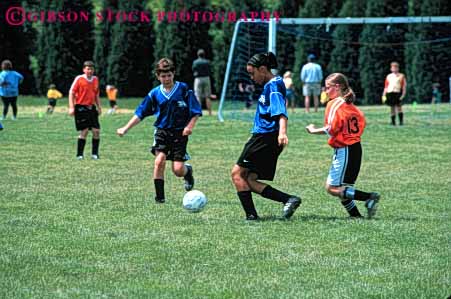 Stock Photo #5753: keywords -  active african american ball black boys child children compete competing competition competitor cooperate cooperating cooperative coordinate effort elementary ethnic exercise fitness girls goal horz kick minority mixed physical plan ran recreation run runner running school soccer social sport team uniform uniforms workout youth
