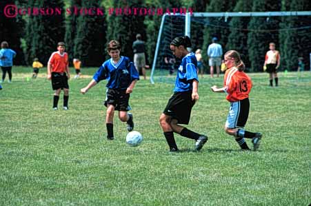 Stock Photo #5753: keywords -  active african american ball black boys child children compete competing competition competitor cooperate cooperating cooperative coordinate effort elementary ethnic exercise fitness girls goal horz kick minority mixed physical plan ran recreation run runner running school soccer social sport team uniform uniforms workout youth