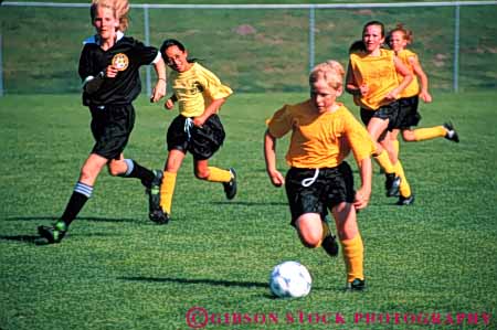 Stock Photo #5754: keywords -  active african american ball black boys child children coed compete competing competition competitor cooperate cooperating cooperative coordinate effort elementary exercise fitness gender girls goal horz kick minority mixed physical plan ran recreation run runner running school soccer social sport team uniform uniforms workout youth