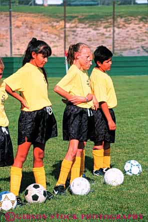 Stock Photo #5756: keywords -  active ball boys child children compete competing competition competitor cooperate cooperating cooperative coordinate effort elementary ethnic exercise fitness gender girls goal kick minority mixed physical plan ran recreation run runner running school soccer social sport team uniform uniforms vert workout youth