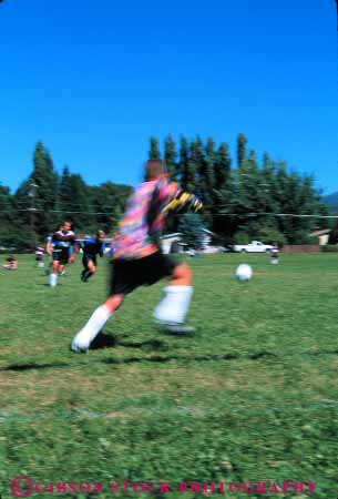 Stock Photo #5765: keywords -  action active ball blur boy child children compete competing competition competitor cooperate cooperating cooperative coordinate dynamic effort exercise fitness goal goalie kick middle motion move movement moving physical plan ran recreation run runner running school soccer social sport team uniform uniforms vert workout youth