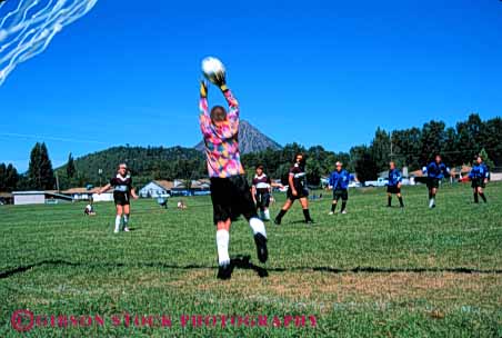 Stock Photo #5766: keywords - action active ball blur catch child children compete competing competition competitor cooperate cooperating cooperative coordinate dynamic effort exercise fitness goal goalie horz kick middle move movement moving physical plan ran recreation run runner running school soccer social sport team uniform uniforms workout youth