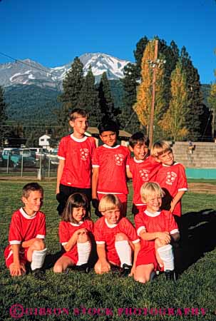 Stock Photo #5767: keywords - active ball boys child children compete competing competition competitor cooperate cooperating cooperative coordinate effort elementary ethnic exercise fitness gender girls goal kick mixed physical plan ran recreation released run runner running school soccer social sport team uniform uniforms vert workout youth