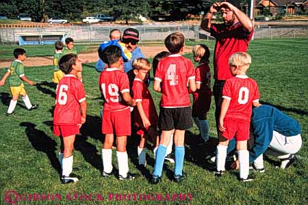Stock Photo #5768: keywords -  active ball child children compete competing competition competitor cooperate cooperating cooperative coordinate effort elementary exercise fitness goal horz kick middle plan ran recreation released run runner running school soccer social sport team uniform uniforms workout youth
