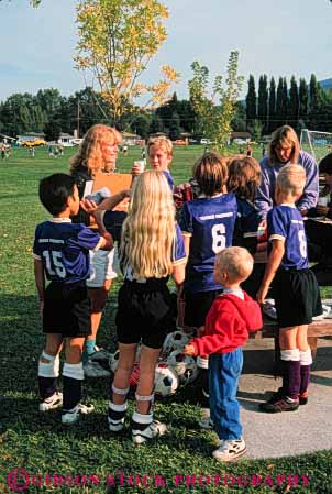 Stock Photo #5769: keywords -  active ball boys break child children coed compete competing competition competitor cooperate cooperating cooperative coordinate effort exercise fitness gender girls goal kick middle mixed physical plan ran recreation rest run runner running school soccer social sport team uniform uniforms vert workout youth