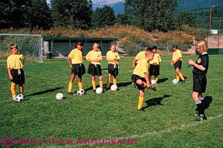 Stock Photo #5771: keywords - active ball boys child children compete competing competition competitor cooperate cooperating cooperative coordinate effort ethnic exercise fitness gender girls goal horz kick middle minority mixed physical plan ran recreation run runner running school soccer social sport stretch team uniform uniforms up warm workout youth