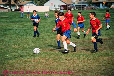 Stock Photo #5773: keywords - action active ball boys child children compete competing competition competitor cooperate cooperating cooperative coordinate effort exercise fitness goal horz kick middle physical plan ran recreation run runner running school soccer social sport team uniform uniforms workout youth