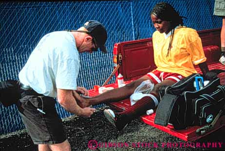 Stock Photo #3550: keywords -  accident african aid american ethnic first horz injury medical prepare prevention released soccer sport sports strengthen treatment woman