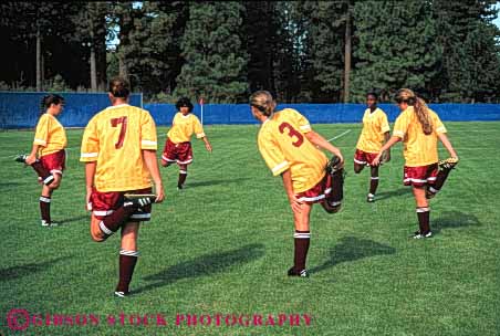 Stock Photo #5782: keywords -  active adult athlete athletic ball college compete competing competition competitor cooperate cooperating cooperative coordinate effort exercise female fitness goal horz kick physical plan ran recreation run runner running school soccer social sport stretch stretching student team uniform uniforms up warm woman womans women womens workout youth