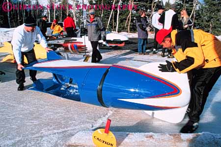 Stock Photo #5785: keywords -  active aerodynamic bobsled city compete competing competition competitor cooperate cooperating cooperative coordinate downhill effort fast fiberglass frozen gravity horz ice men park plastic preparation race racer racing ran recreation run runner running sled sledding slide slippery snow speed sport sports team uniform uniforms ut utah vehicle winter