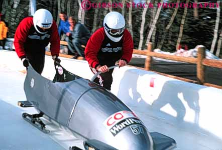 Stock Photo #5786: keywords - action active aerodynamic blur bobsled city compete competing competition competitor cooperate cooperating cooperative coordinate downhill dynamic effort fast fiberglass frozen gravity horz ice men move movement moving park plan plastic push race racer racing ran recreation run runner running sled sledding slide slippery snow speed sport sports start team two uniform uniforms ut utah vehicle winter
