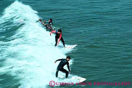 Stock Photo #5791: keywords - action balance coast fast float glide gravity horz man men motion move movement moving ocean recreation sea speed splash sport surf surfer surfing water wave wet wetsuit young