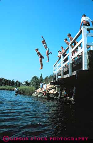 Stock Photo #5793: keywords -  adolescents bridge cape centerville child children cod cool fun group groups jump jumped jumping jumps kid kids lake leap leaped leaping leaps massachusetts outdoor outdoors outside play recreation refresh refreshing risk river sport summer swim swimmer swimmers swimming teen teenage teenager teenagers teens vert warm water wet