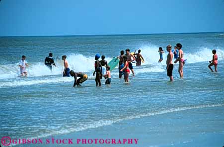 Stock Photo #5794: keywords -  adolescent adolescents african american beach black children cool ethnic fl florida horz jacksonville minority mixed ocean outdoor outdoors outside play recreation refresh refreshing sea sport summer surf swim swimmer swimmers swimming warm water wet