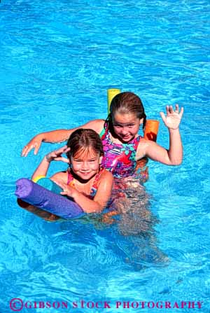 Stock Photo #5797: keywords -  cool float girls lake ocean outdoor outdoors outside play pool recreation refresh refreshing released river sea smile sport summer swim swimmer swimmers swimming two vert warm water wet