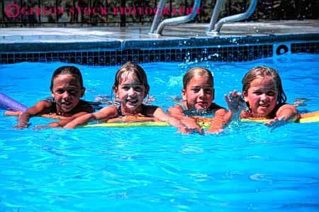 Stock Photo #5808: keywords -  cool float friend friends fun girl girls group horz outdoor outdoors outside play pool recreation refresh refreshing released sport summer swim swimmer swimmers swimming team together warm water wet
