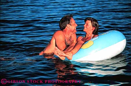 Stock Photo #5809: keywords - affection alone cool couple float fun horz husband intimate lake love man outdoor outdoors outside play private recreation refresh refreshing released river share solitude sport summer swim swimmer swimmers swimming together warm water wet wife woman