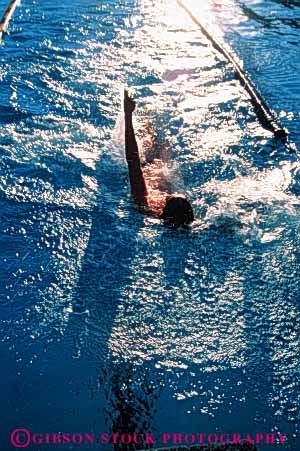 Stock Photo #5811: keywords -  backstroke challenge compete competing competition competitor contest effort man outdoor outdoors outside pool race recreation side speed sport summer swim swimmer swimmers swimming vert water wet winner