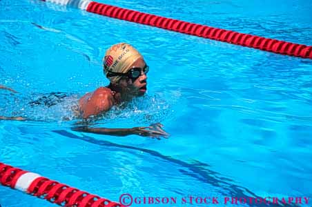 Stock Photo #5815: keywords - action african american black blur boy breaststroke challenge compete competing competition competitor contest dynamic effort exertion horz minority move movement moving outdoor outdoors outside pool race recreation side speed sport summer swim swimmer swimmers swimming water wet winner