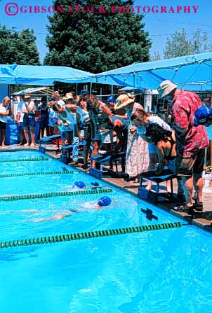 Stock Photo #5822: keywords -  action blur challenge compete competing competition competitor contest coordinate coordination dynamic effort exertion finish judges move movement moving outdoor outdoors outside pool race recreation side speed sport summer swim swimmer swimmers swimming synchronize synchronized timers vert water wet winner