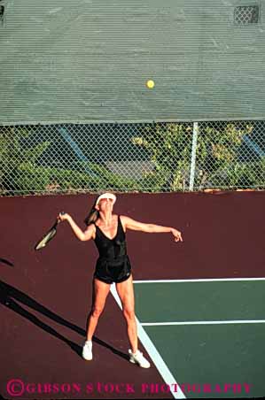 Stock Photo #5828: keywords -  agility ball court exercise game hit match motion move movement moving net opponent opposition outdoor outdoors outside pair play playing racket racquet rebound recreation run serve sport summer swing tennis vert vitality woman workout