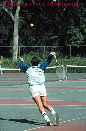 Stock Photo #5829: keywords -  agility ball court exercise game hit man match motion move movement moving net opponent opposition outdoor outdoors outside pair play playing power racket racquet rebound recreation run serve sport summer swing tennis vert vitality workout