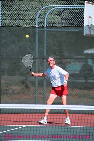 Stock Photo #13492: keywords -  active activity aged aging athlete athletes athletic athletics california challenge challenging citizen citizens commitment compete competing competition competitor competitors condition conditioning contest contestants contests coordination demanding determination effort elderly endurance exercise exercising exertion fit fitness games longevity man match mature net old olympics people performance physical physically play player playing plays racket recreation redding senior seniors sports strength strenuous swing tennis training vert