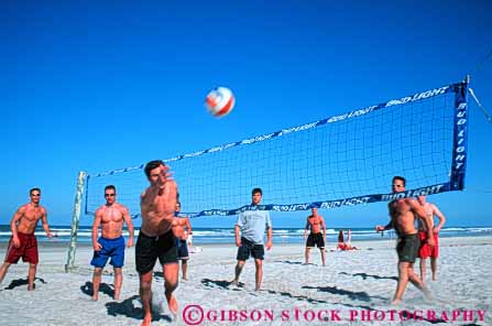 Stock Photo #5833: keywords -  agility athlete ball beach bounce coordinate coordinated coordination court exercise game hit horz jump man match men motion move movement moving net opponent opposition outdoor outdoors outside pair play power rebound recreation run sport summer swing team vitality volleyball workout