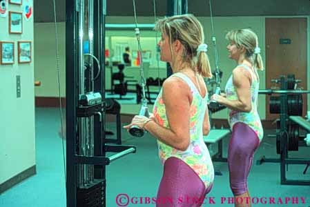 Stock Photo #5837: keywords -  aerobic develop equipment exercise female gym health horz indoor machine move movement muscle power recreation released repetition sport strength strengthen strong training weight woman workout