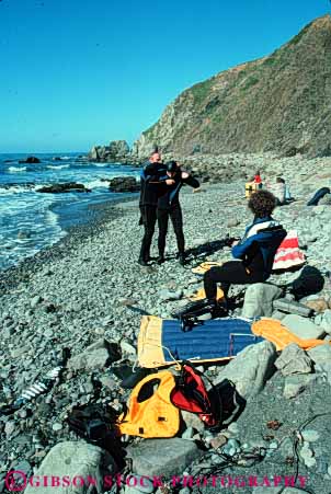 Stock Photo #5840: keywords -  abalone california coast dive diver divers diving for harvest hunt invertebrate man men mendocino mollusk ocean prepare shell shellfish shore snail sport vert wetsuit