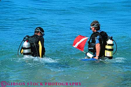 Stock Photo #5845: keywords -  adventure beach coast dive diver divers diving enter flag hawaii horz maui ocean pair partner risk scuba shore sport suit team warm wetsuit