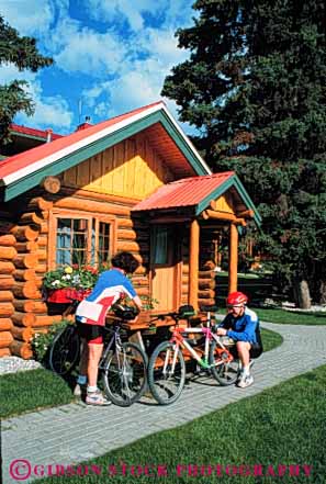 Stock Photo #5853: keywords - balance bicycle bicycling bike cabin country couple human log mountain peddle power recreation released resort ride roll sport steer summer together transportation two vacation vert wheel wheels