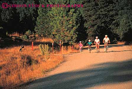 Stock Photo #5855: keywords -  balance bicycle bicycling bike boy child children country family father four girl horz human husband mother parent parents peddle power recreation released ride road roll share sport steer summer together transportation two vacation wheel wheels