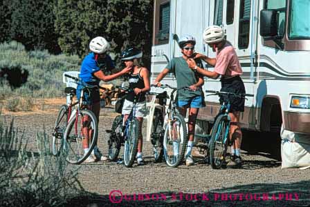 Stock Photo #5859: keywords -  adventure balance bicycle bicycling bike camp camping equipment explore family four gear group horz human pack packed peddle power recreation released ride roll sport steer summer together touring transportation travel trip two vacation wheel wheels